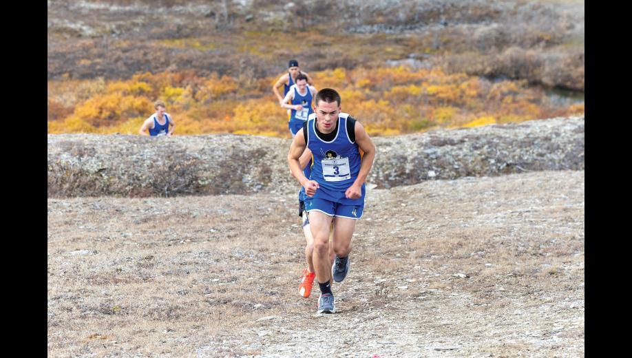 UP THE HILL – Jackson Iverson leads a pack of runners up towards Glacier Creek Road at the Big West Regional Meet at Nome-Beltz High School on Saturday, September 26. Photo by Ariana Crockett O'Harra