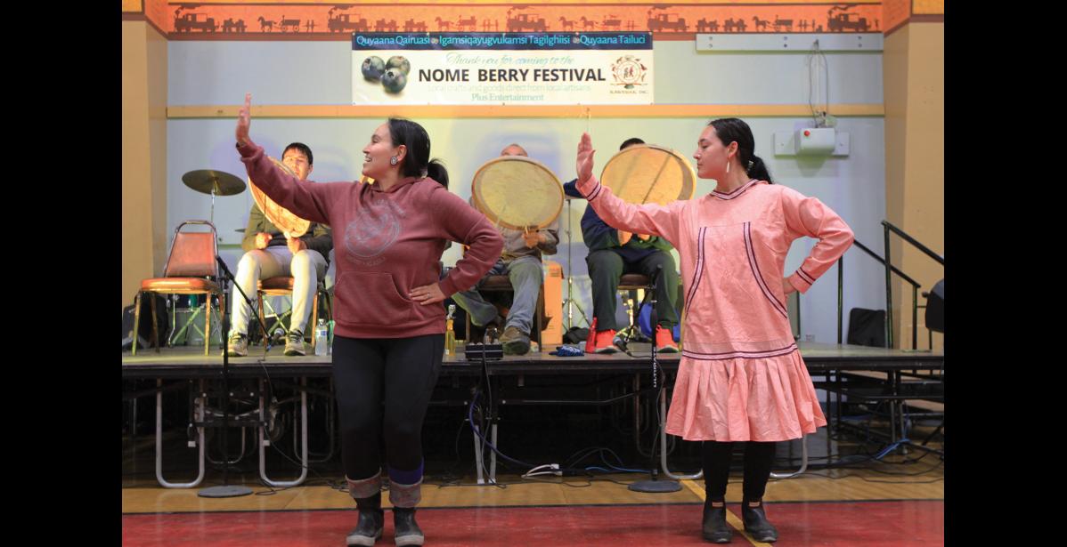 Photo by Anna Lionas FAMILY FUN — Cousins Asaaluk Nichols and Kaitlyn Painter dance together during the performance of the King Island Dance Group.