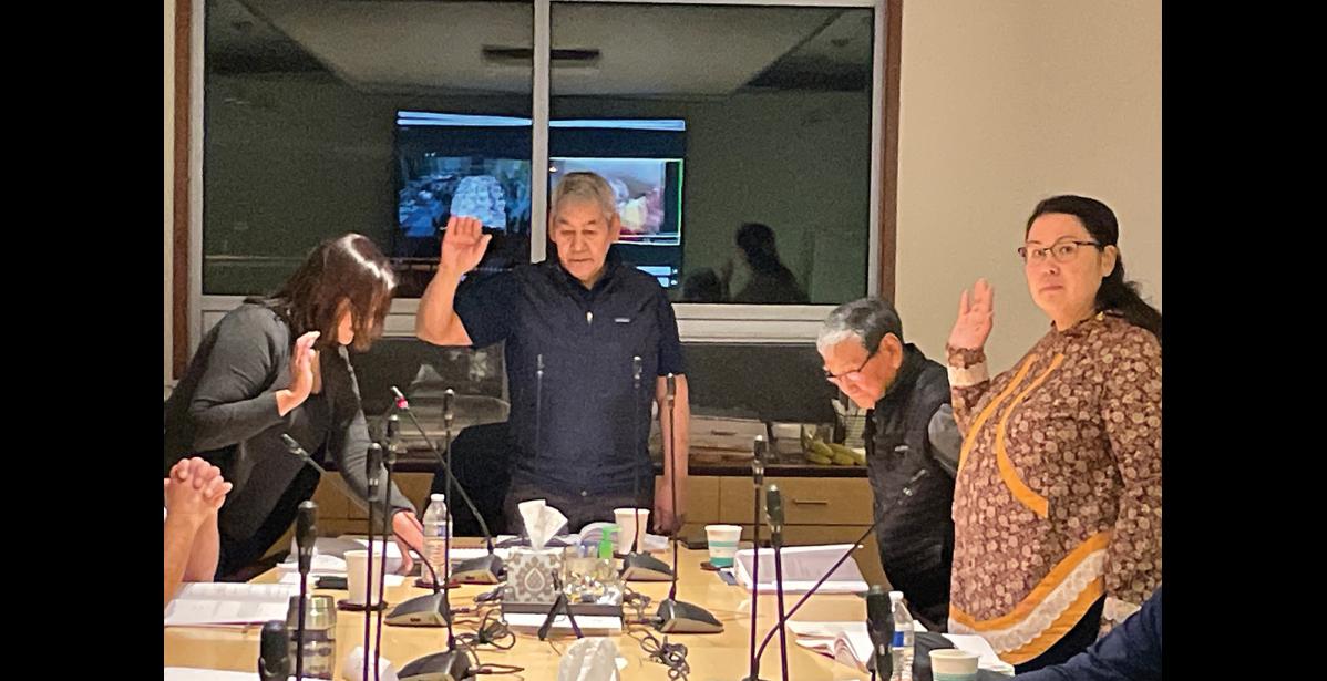 Photo by Anna Lionas SWORN IN- NSEDC CEO Janis Ivanoff swears in reelected members Frank Katchatag, Harvey Sookiayak and newly elected member Frieda Southall during NSEDC’s Board of Directors meeting in their Nome offices, November 3.