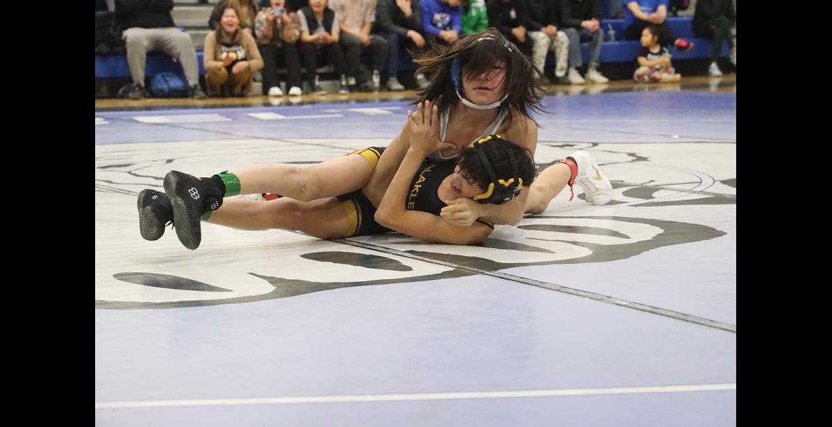 Photo by Laura Robertson CHAMPIONS— Brant Bradley, Nome, and Dane Johnson, Unalakleet, wrestle for first place in their weight class, during the Dudley Homelvig Scramble, held last weekend in Nome.