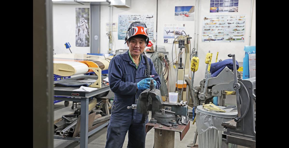 Photo by Megan Gannon BEHIND THE SCENES — Hai Nguyen, an employee who has been with Bering Air for 22 years, works inside the machine shop in Nome.