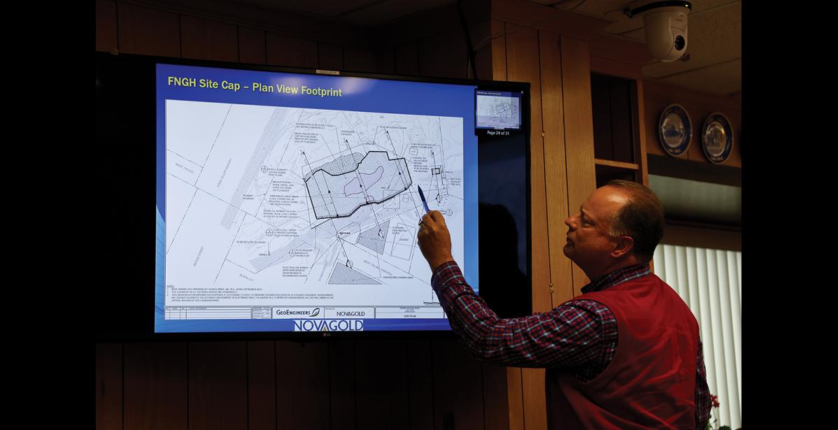 Photo by Megan Gannon FILL AREA — Phil Welker, of GeoEngineers, explains how monitoring efforts led to the plan to cover about one acre of contaminated ground with fill to prevent erosion.