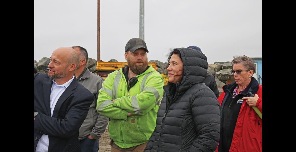 Photo by Megan Gannon ORT TOUR — BSNC interim CEO Dan Graham, Harbormaster Lucas Stotts, SBA Administrator Isabella Casillas Guzman and Port Director Joy Baker looked at cargo coming into Nome last week.