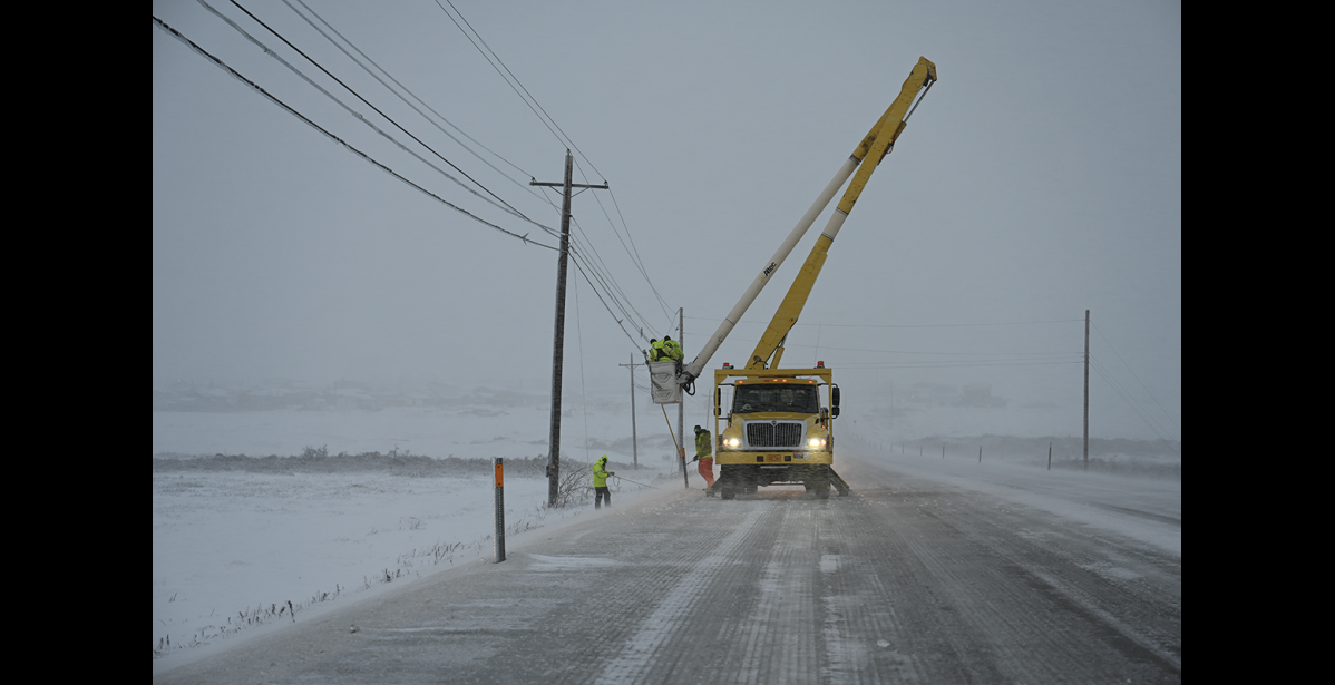 Photo by Nikolai Ivanoff ICY WIRES— A NJUS line crew was busy removing ice from wires on Sunday, Dec. 4, 2022.