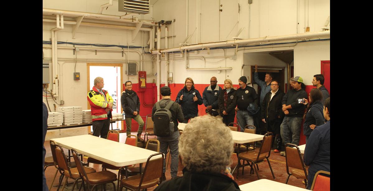 Photo by Peter Loewi Nome Mayor John Handeland, Representative Mary Peltola, FEMA Administrator Deanne Criswell, FEMA Region 10 Administrator Willie Nunn, Senator Lisa Murkowski, and Director of the Alaska Division for Homeland Security and Emergency Management Bryan Fisher address first responders in the Nome Fire Hall.