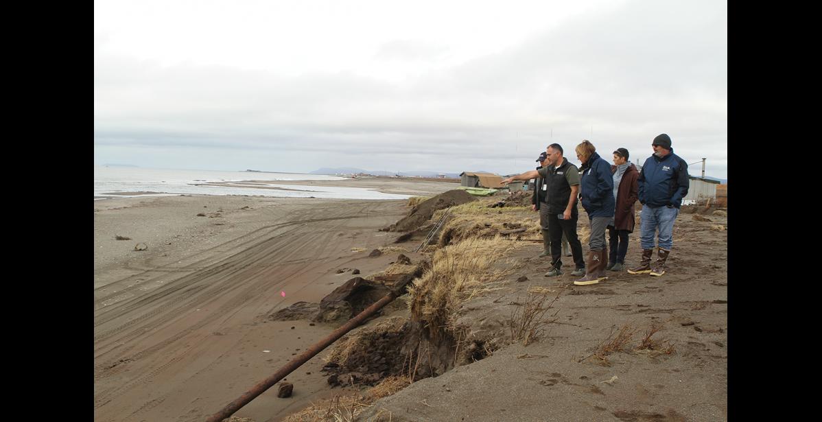 Photo by Peter Loewi BSNC’s Larry Pederson points out how deeply eroded Fort Davis was during the storm to FEMA Administrator Deanne Criswell. The beach originally stopped at the pink flags.