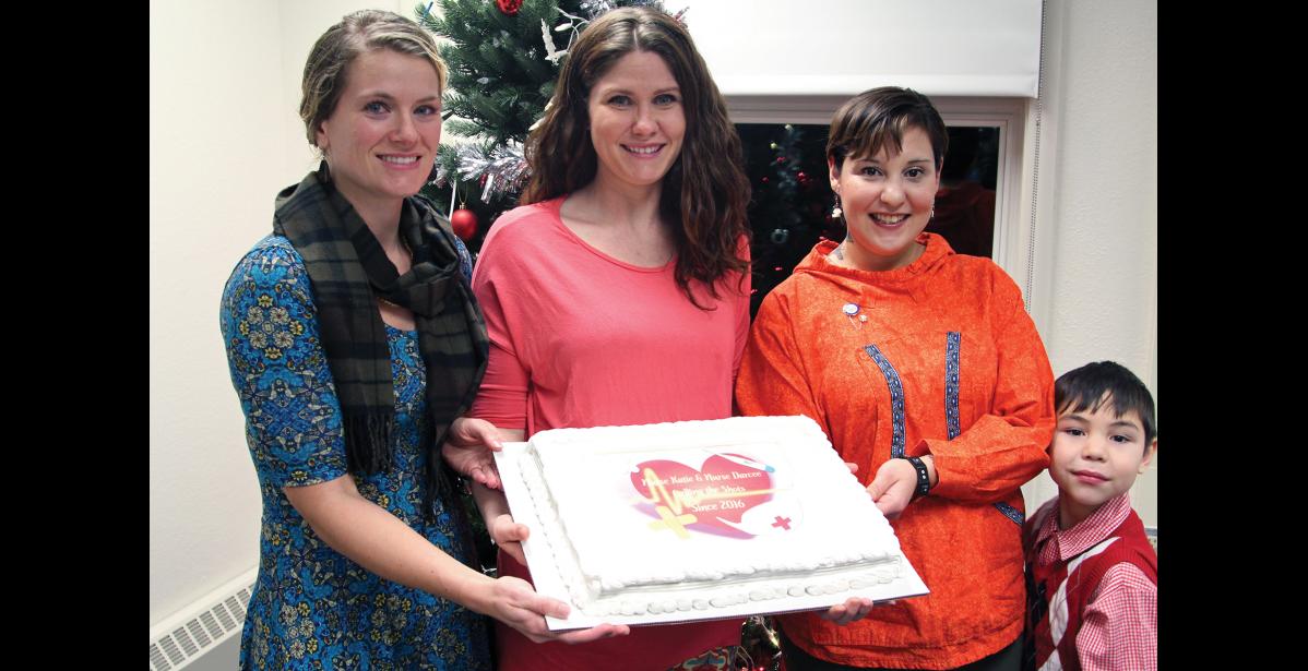 Photo by Reba Lean CELEBRATING— Darcee Perkins, left, and Katie Elanna, right, pose with their nursing instructor Mindy McIntosh, center, at the Nurse Pinning ceremony on Dec. 15, 2016.