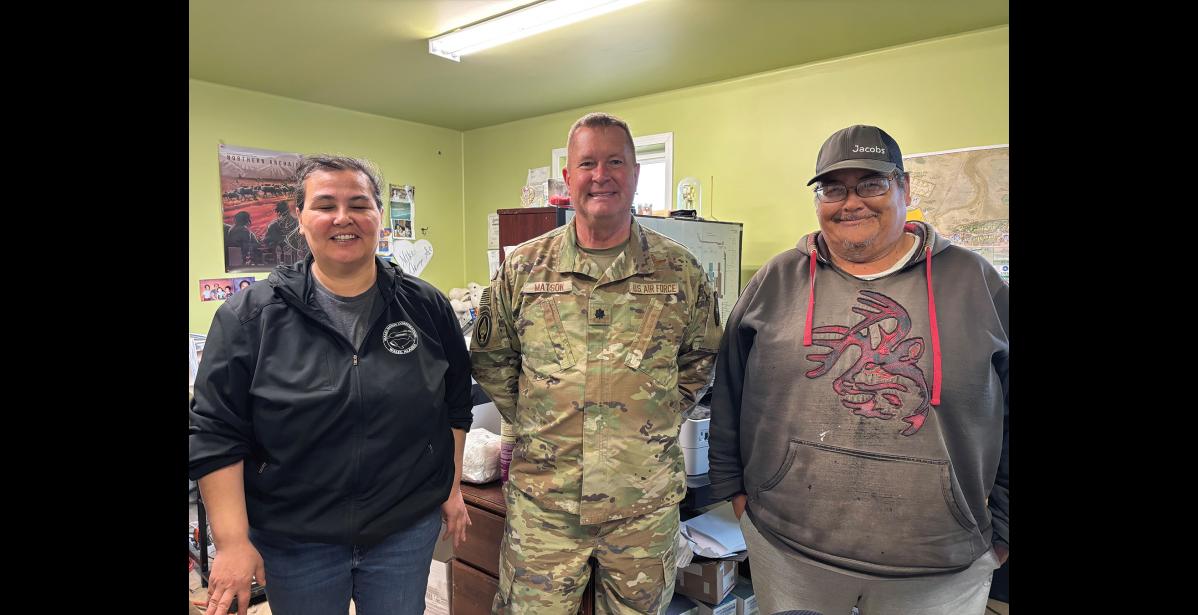 VISITING— U.S. Air Force Lt Col Tim Matson, with SOCNORTH, visited Terry and Bill Crisci in the Wales Native Corporation Building, on Tuesday, August 18. Photo courtesy Lt. Col. Tim Matson