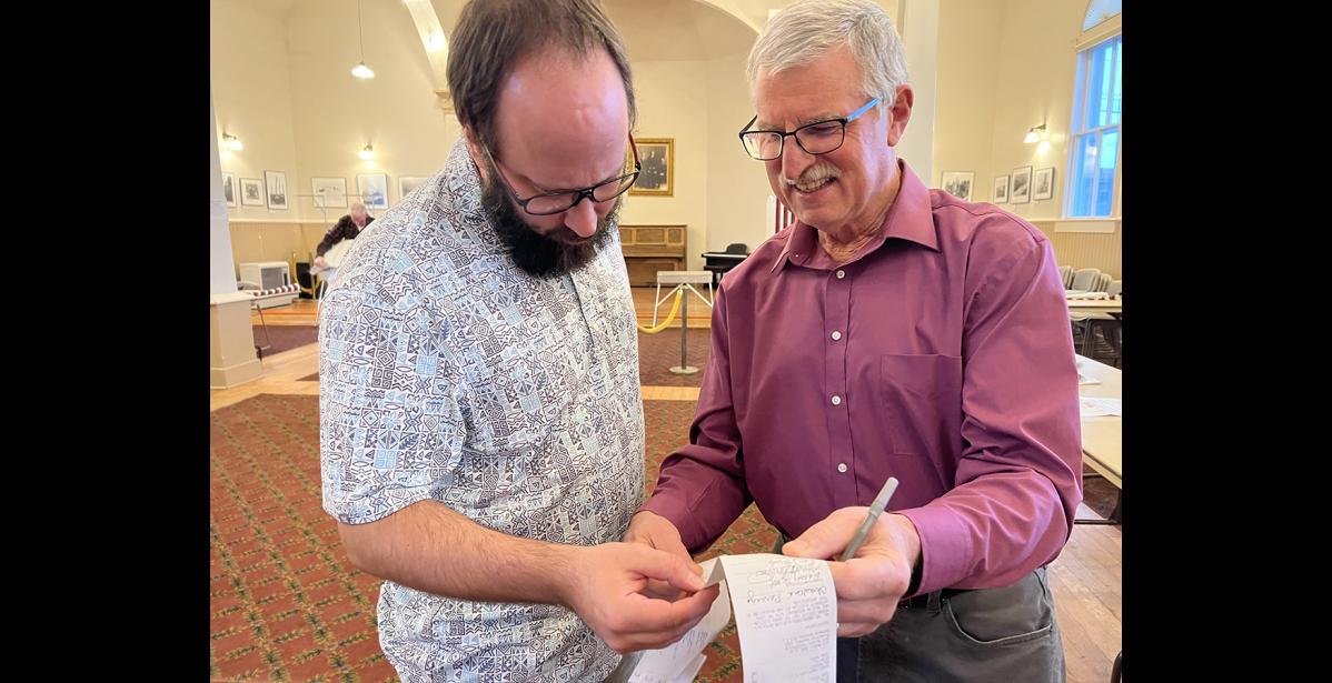 Photo by Diana Haecker ity Clerk Bryant Hammond and Election Judge Lloyd Perrigo look over election results on Tuesday, Oct. 3.