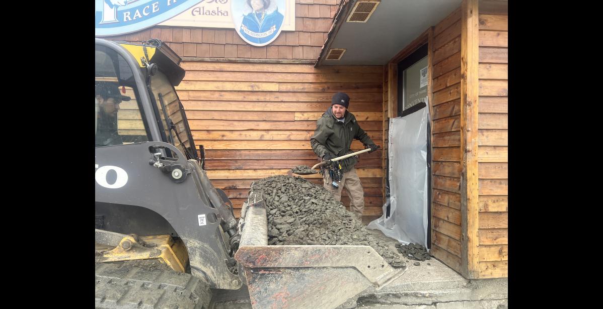 Photo by Diana Haecker City Public Works employee Ilya Komarow helps shore up the Mini Convention Center as flooding is expected.