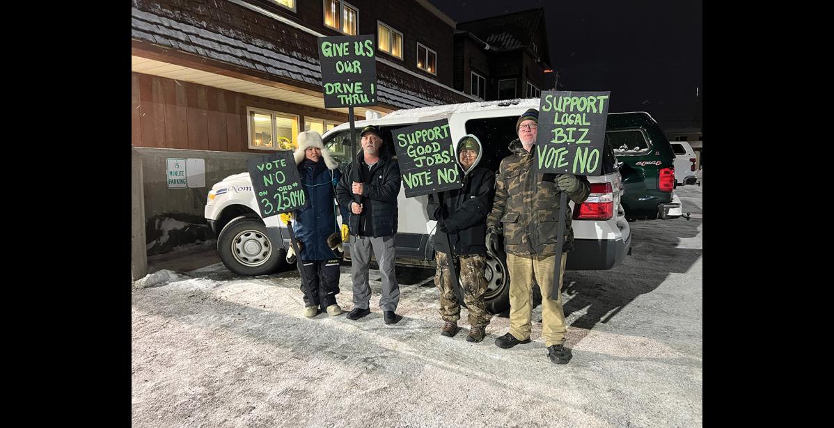 Photo by Diana Haecker Dora Ahwinona, Greg Smith, Selma Rock and Eric Smith make their voices heard outside City Hall on Monday, January 19 when the Nome Common Council was supposed to work on an ordinance to ban drive-through windows for marijuana shops. The meeting was postponed as no quorum was reached and the ordinance vote took place on January 26, when the council voted down the ordinance.