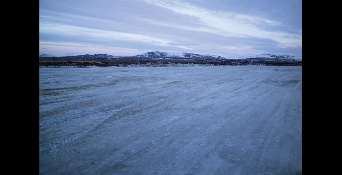Photo by Nils Hahn SNOW DUMP— City crews don’t have to move much snow these days, as evidenced by the empty, icy snow dump facility off Greg Kruschek Ave.