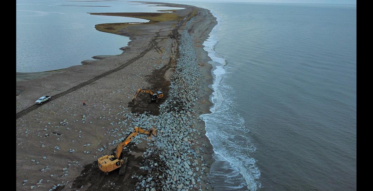 Photo by Silas Takak FINDING THE ROAD— Local DOT and KNIK employees work to rebuild the seawall and re-establish the Nome-Council Highway east of Cape Nome.
