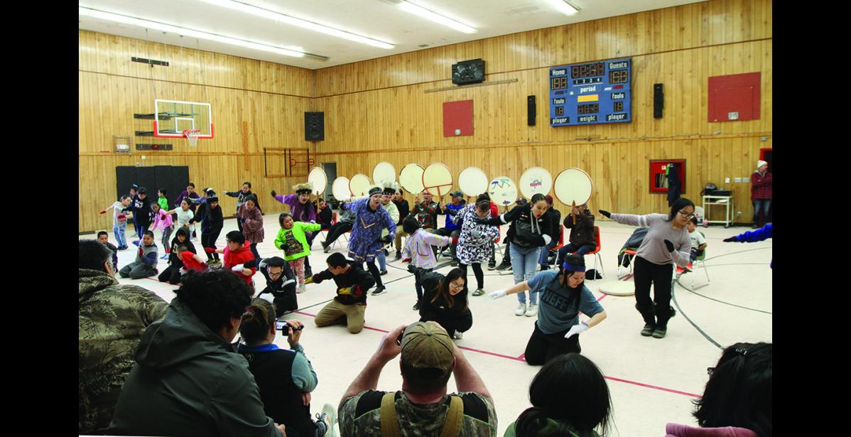 Photo by Peter Loewi CELEBRATION— Over 100 people came out Wednesday, April 27 to dance, drum, or just watch at the St. Michael community gym. The event marked the end of a RurAL CAP workshop with acclaimed Yupik artist Aassanaaq “Ossie” Kairaiuak.