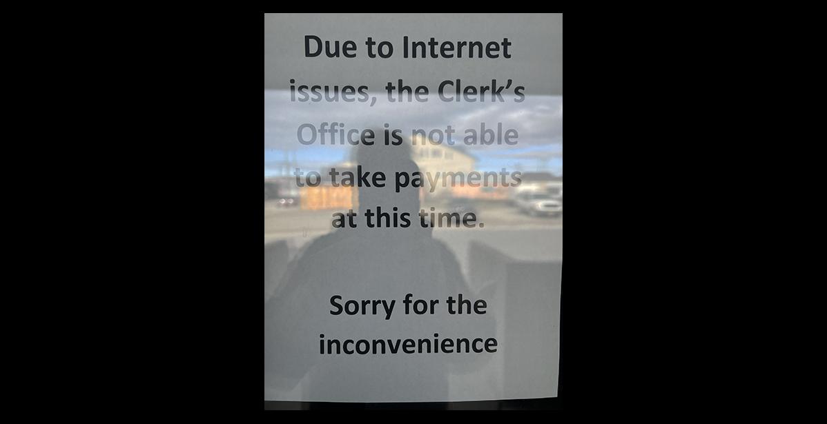 Photo by Diana Haecker A sign at City Hall in Nome informs that the City Clerk cannot take payments, on Monday, June 12, due to an internet outage.