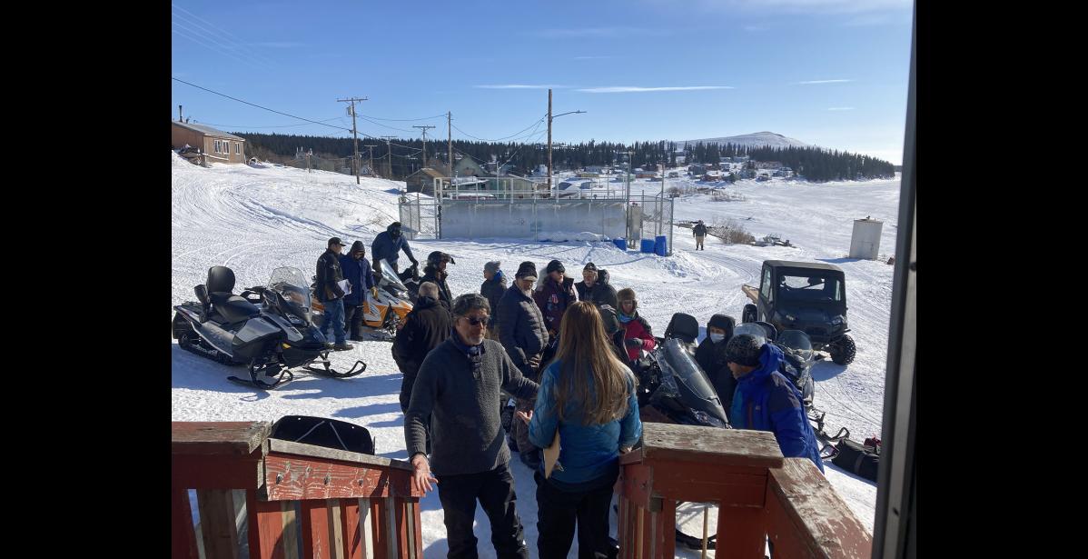 Photo by RB Smith Volunteers gather around Gerard Thiart as he arrived with Ed Stang in the White Mountain checkpoint.