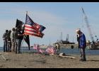 Photo by Peter Loewi PRAYER—Nome VFW Chaplain Aaron Iworrigan leads a prayer at Belmont Point for service members lost at sea.