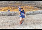UP THE HILL – Jackson Iverson leads a pack of runners up towards Glacier Creek Road at the Big West Regional Meet at Nome-Beltz High School on Saturday, September 26. Photo by Ariana Crockett O'Harra