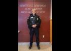 NEW TO THE FORCE – Son Erikson poses for a photo at the Nome Police Department on Tuesday, October 13. Photo by Ariana Crockett O’Harra