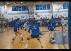SCRAMBLE – Nanooks scramble for the ball during an afternoon game against the Kotzebue Huskies on Saturday, September 12 at the Nome-Beltz gym. Photo by Ariana Crockett O'Harra