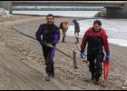 SEARCHING FOR FLORENCE – SAR divers Tom and Joe Akeya of Savoonga walk up the beach after a day of diving off the causeway seawall at Nome’s West Beach. They assisted the search for Florence Okpealuk, who has last been seen on August 30 at West Beach