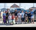 READY FOR CANDY – A group of spectators smile big while awaiting the start of Nome’s Fourth of July Parade.